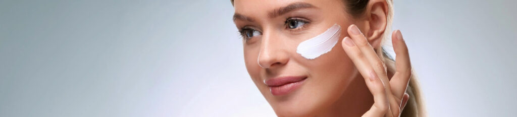 Woman Applying Cream to Make her Skin Bright and Beautiful