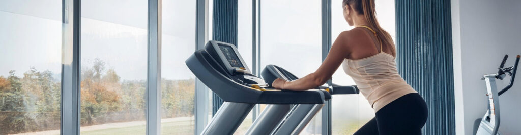 Woman Exercising on a Treadmill