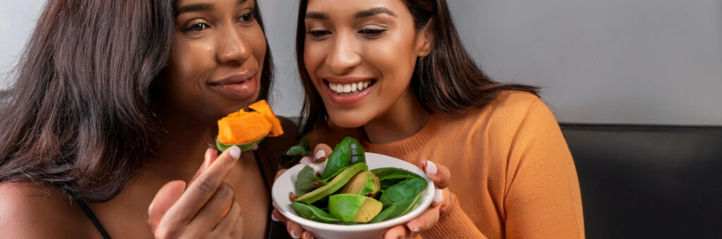 Women Eating Avocados Spinach and Sweet Potatoes